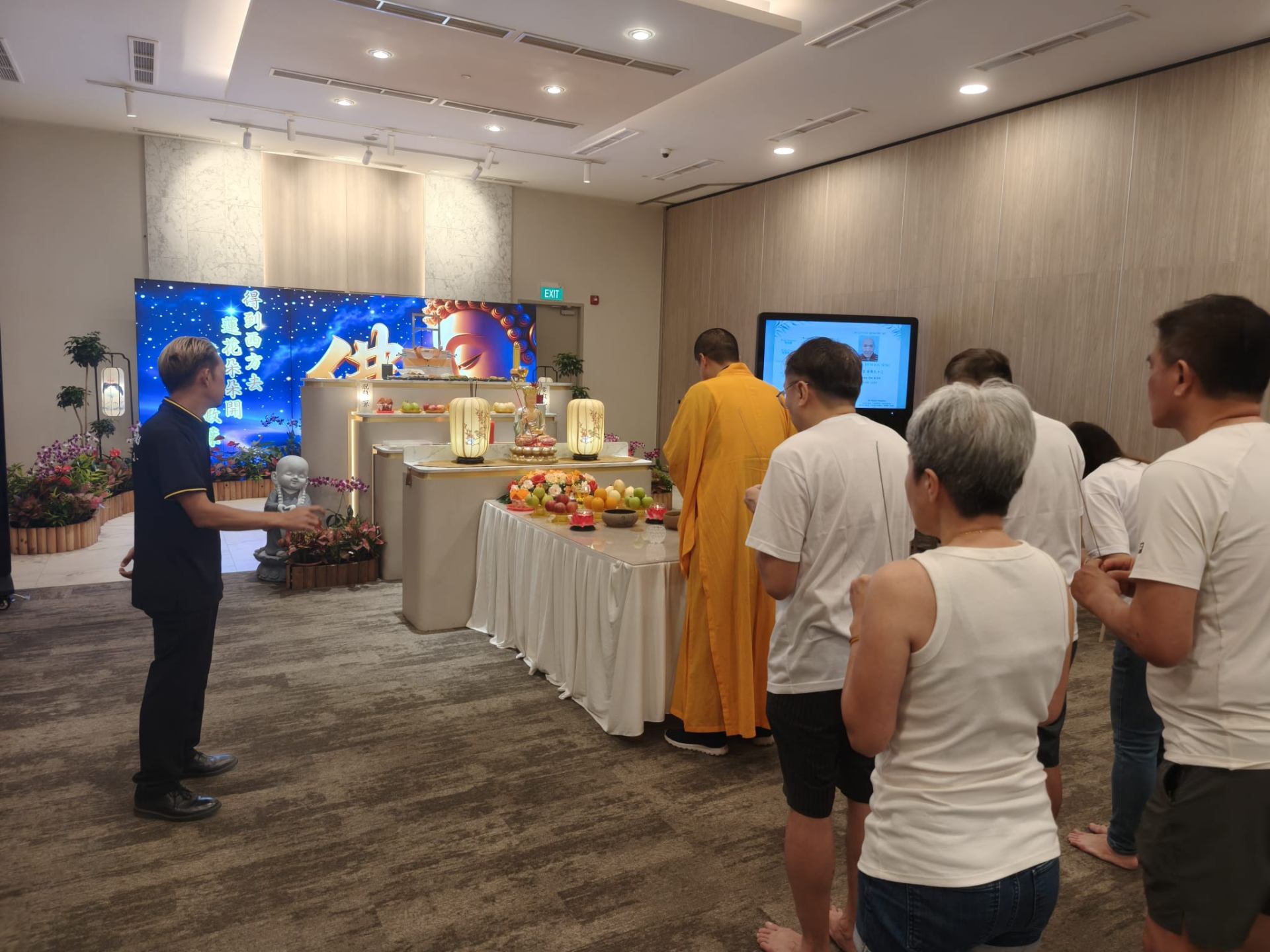 Buddhist ceremony with monks and attendees