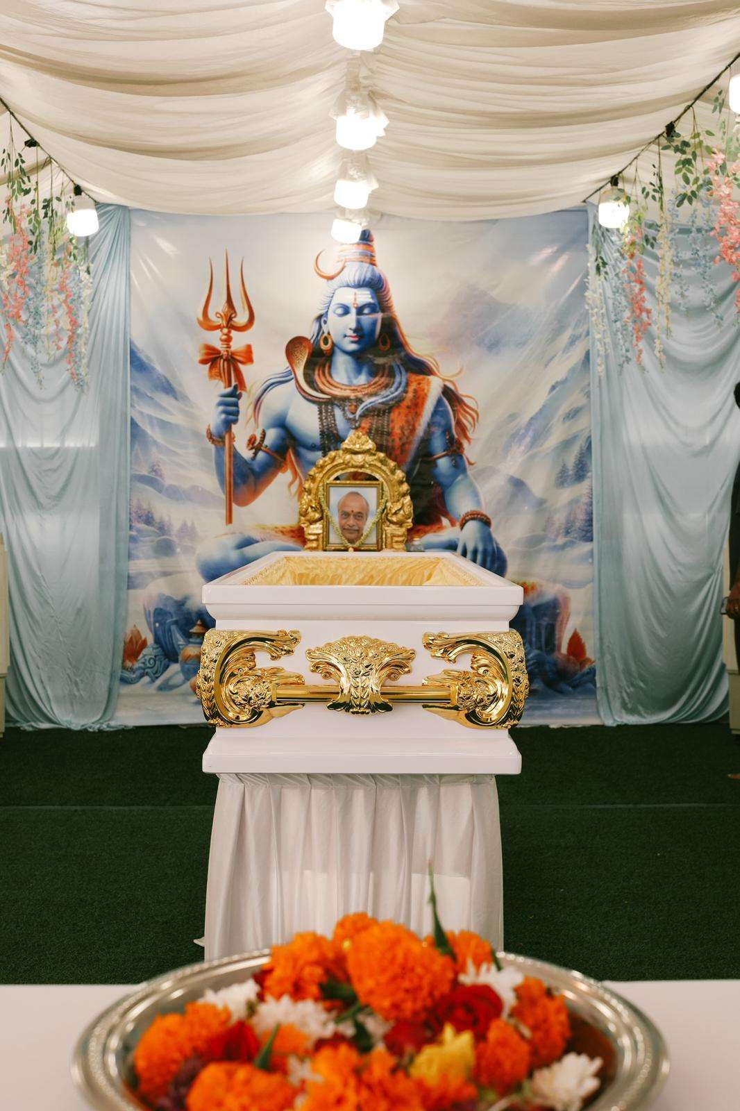 Hindu funeral altar with sacred flowers and religious items in Singapore
